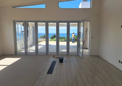 Interior renovation and floor replacement on a modern coastal home